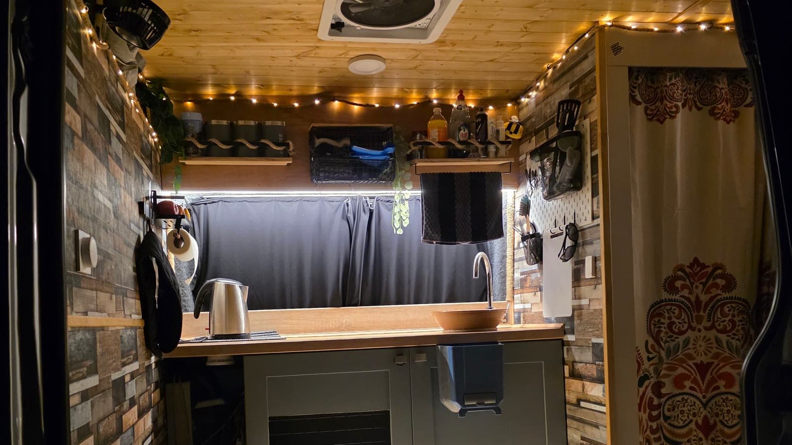 Interior of a campervan conversion with warm lighting